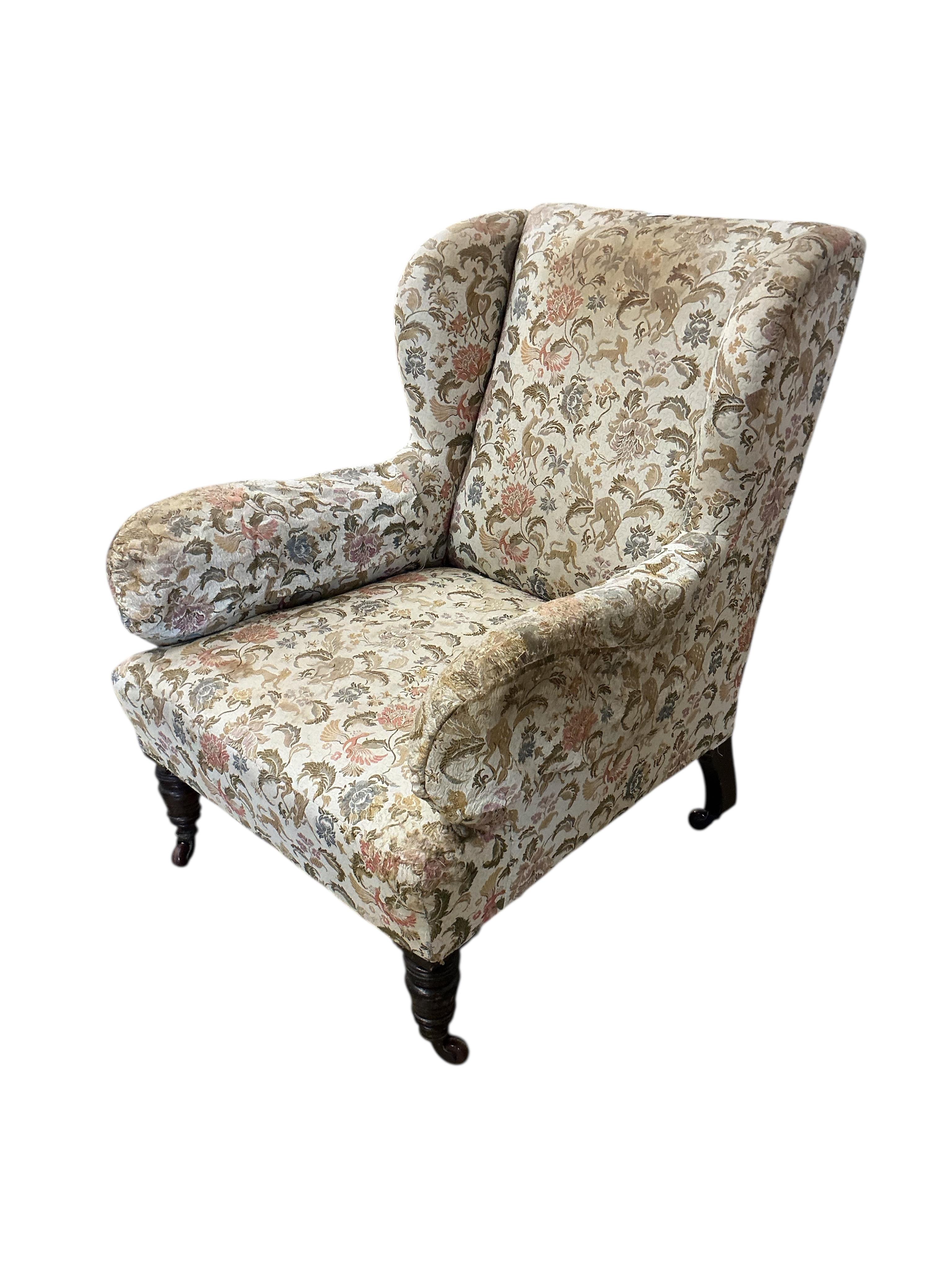 A late Victorian upholstered wing armchair, width 75cm, depth 78cm, height 91cm